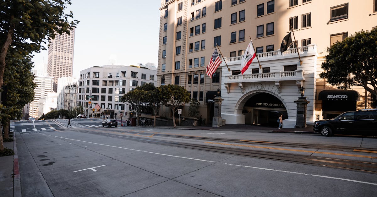 Streetscape of San Francisco featuring the Stanford Court Hotel and city architecture.